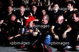 14.11.2010 Abu Dhabi, Abu Dhabi,  Sebastian Vettel (GER), Red Bull Racing 2010 World Champion, celebrates with the team - Formula 1 World Championship, Rd 19, Abu Dhabi Grand Prix, Sunday Podium