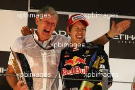 14.11.2010 Abu Dhabi, Abu Dhabi,  Helmut Marko (AUT), Red Bull Racing, Red Bull Advisor and Sebastian Vettel (GER), Red Bull Racing - Formula 1 World Championship, Rd 19, Abu Dhabi Grand Prix, Sunday Podium