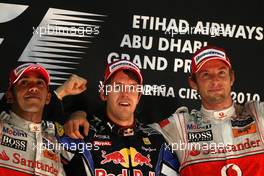 14.11.2010 Abu Dhabi, Abu Dhabi,  2nd place Lewis Hamilton (GBR), McLaren Mercedes with New world Champion and 1st place Sebastian Vettel (GER), Red Bull Racing and 3rd place Jenson Button (GBR), McLaren Mercedes - Formula 1 World Championship, Rd 19, Abu Dhabi Grand Prix, Sunday Podium