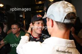 14.11.2010 Abu Dhabi, Abu Dhabi,  Michael Schumacher (GER), Mercedes GP Petronas congratulates Sebastian Vettel (GER), Red Bull Racing - Formula 1 World Championship, Rd 19, Abu Dhabi Grand Prix, Sunday Podium