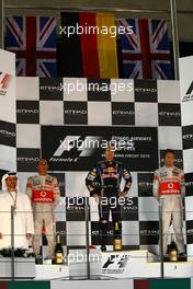 14.11.2010 Abu Dhabi, Abu Dhabi,  2nd place Lewis Hamilton (GBR), McLaren Mercedes with New world Champion and 1st place Sebastian Vettel (GER), Red Bull Racing and 3rd place Jenson Button (GBR), McLaren Mercedes - Formula 1 World Championship, Rd 19, Abu Dhabi Grand Prix, Sunday Podium