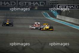 14.11.2010 Abu Dhabi, Abu Dhabi,  Vitaly Petrov (RUS), Renault F1 Team, Sebastian Vettel (GER), Red Bull Racing and Mark Webber (AUS), Red Bull Racing   - Formula 1 World Championship, Rd 19, Abu Dhabi Grand Prix, Sunday Race