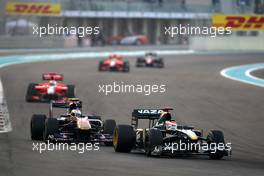 14.11.2010 Abu Dhabi, Abu Dhabi,  Jarno Trulli (ITA), Lotus F1 Team, T127 leads Jaime Alguersuari (ESP), Scuderia Toro Rosso, STR05 - Formula 1 World Championship, Rd 19, Abu Dhabi Grand Prix, Sunday Race