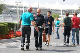13.11.2010 Abu Dhabi, Abu Dhabi,  Adrian Newey (GBR), Red Bull Racing, Technical Operations Director being told by paddock security to wear his F1 pass around his neck - Formula 1 World Championship, Rd 19, Abu Dhabi Grand Prix, Saturday