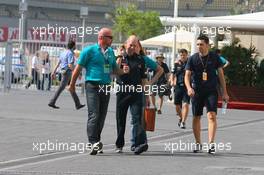 13.11.2010 Abu Dhabi, Abu Dhabi,  Adrian Newey (GBR), Red Bull Racing, Technical Operations Director being told by paddock security to wear his F1 pass around his neck - Formula 1 World Championship, Rd 19, Abu Dhabi Grand Prix, Saturday