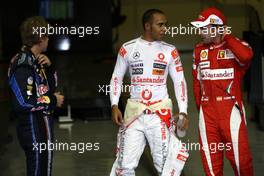 13.11.2010 Abu Dhabi, Abu Dhabi,  Lewis Hamilton (GBR), McLaren Mercedes with pole man Sebastian Vettel (GER), Red Bull Racing and Fernando Alonso (ESP), Scuderia Ferrari - Formula 1 World Championship, Rd 19, Abu Dhabi Grand Prix, Saturday Qualifying