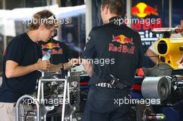 11.11.2010 Abu Dhabi, Abu Dhabi,  Sebastian Vettel (GER), Red Bull Racing looking at his car - Formula 1 World Championship, Rd 19, Abu Dhabi Grand Prix, Thursday