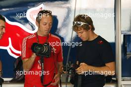 11.11.2010 Abu Dhabi, Abu Dhabi,  Sebastian Vettel (GER), Red Bull Racing with a digital camera - Formula 1 World Championship, Rd 19, Abu Dhabi Grand Prix, Thursday