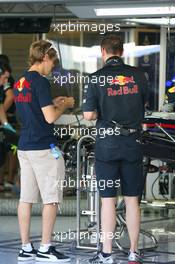 11.11.2010 Abu Dhabi, Abu Dhabi,  Sebastian Vettel (GER), Red Bull Racing looking at his car - Formula 1 World Championship, Rd 19, Abu Dhabi Grand Prix, Thursday