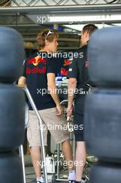 11.11.2010 Abu Dhabi, Abu Dhabi,  Sebastian Vettel (GER), Red Bull Racing looking at his car - Formula 1 World Championship, Rd 19, Abu Dhabi Grand Prix, Thursday