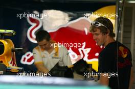 11.11.2010 Abu Dhabi, Abu Dhabi,  Sebastian Vettel (GER), Red Bull Racing taking a look at Mark Webber's car - Formula 1 World Championship, Rd 19, Abu Dhabi Grand Prix, Thursday