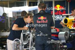 11.11.2010 Abu Dhabi, Abu Dhabi,  Sebastian Vettel (GER), Red Bull Racing looking at his car - Formula 1 World Championship, Rd 19, Abu Dhabi Grand Prix, Thursday