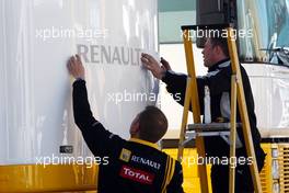 01.02.2010 Valencia, Spain,  Renault put stickers on there motorhome - Formula 1 Testing, Valencia