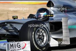 03.02.2010 Valencia, Spain,  Michael Schumacher (GER), Mercedes GP, W01, in a black helmet - Formula 1 Testing, Valencia