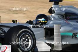 03.02.2010 Valencia, Spain,  Michael Schumacher (GER), Mercedes GP, W01, in a black helmet - Formula 1 Testing, Valencia