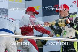 24.04.2010 Hockenheim, Germany,  Champaign on the F3 podium with Marco Wittmann (GER), Signature, Portrait(1st, right) Edoardo Mortara (ITA), Signature, Portrait (2nd, left), Valtteri Bottas (FIN), ART Grand Prix, Portrait (3rd, center) - F3 Euro Series 2010 at Hockenheimring, Hockenheim, Germany