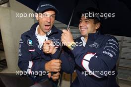 04-11.06.2010 Le Mans, France, Joerg Mueller and Augusto Farfus sing under the rain - 24 Hour of Le Mans 2010