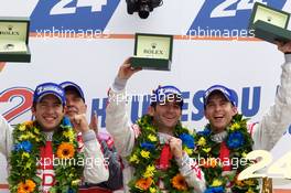 04-11.06.2010 Le Mans, France, LMP1 podium: class and overall winners Mike Rockenfeller, Romain Dumas and Timo Bernhard celebrate with Dr. Wolfgang Ullrich - 24 Hour of Le Mans 2010