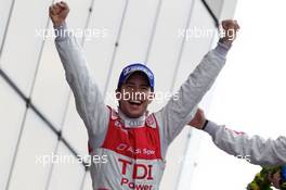 04-11.06.2010 Le Mans, France, Race winner Mike Rockenfeller celebrates on the podium - 24 Hour of Le Mans 2010