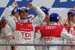 04-11.06.2010 Le Mans, France, Race winners Romain Dumas, Mike Rockenfeller and Timo Bernhard celebrate on the podium - 24 Hour of Le Mans 2010
