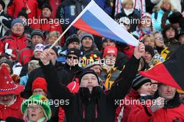 20.01.2011, Antholz, Italy (ITA): Biathlon Feature: russian fan with flag celebrates first russian victory - IBU world cup biathlon, sprint men, Antholz (ITA). www.xpb.cc. © Manzoni/xpb.cc. Every downloaded picture is fee-liable.