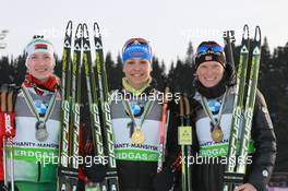 12.03.2011, Khanty-Mansiysk, Russia (RUS): (L-R): Darya Domracheva (BLR), Fischer, Rottefella, Swix, Magdalena Neuner (GER), Fischer, Rottefella, Exel, adidas, Tora Berger (NOR), Fischer, Rottefella, Odlo - IBU world championships biathlon, medals, Khanty-Mansiysk (RUS). www.xpb.cc. © Manzoni/xpb.cc. Every downloaded picture is fee-liable.