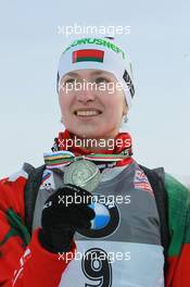12.03.2011, Khanty-Mansiysk, Russia (RUS): Darya Domracheva (BLR), Fischer, Rottefella, Swix - IBU world championships biathlon, medals, Khanty-Mansiysk (RUS). www.xpb.cc. © Manzoni/xpb.cc. Every downloaded picture is fee-liable.