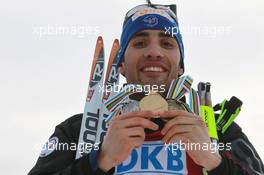 06.03.2011, Khanty-Mansiysk, Russia (RUS): Martin Fourcade (FRA), Rossignol, Rottefella, OneWay, Odlo - IBU world championships biathlon, medals, Khanty-Mansiysk (RUS). www.xpb.cc. © Manzoni/xpb.cc. Every downloaded picture is fee-liable.