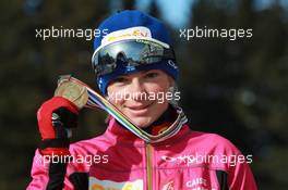 03.03.2011, Khanty-Mansiysk, Russia (RUS): Marie Dorin (FRA), Rossignol, Rottefella, OneWay - IBU world championships biathlon, medals, Khanty-Mansiysk (RUS). www.xpb.cc. © Manzoni/xpb.cc. Every downloaded picture is fee-liable.