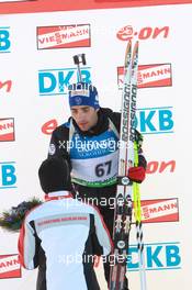 05.03.2011, Khanty-Mansiysk, Russia (RUS): Nami Kim (KOR); IBU vice president and Martin Fourcade (FRA), Rossignol, Rottefella, OneWay, Odlo - IBU world championships biathlon, medals, Khanty-Mansiysk (RUS). www.xpb.cc. © Manzoni/xpb.cc. Every downloaded picture is fee-liable.