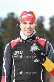 03.03.2011, Khanty-Mansiysk, Russia (RUS): Arnd Peiffer (GER), Fischer, Salomon, Swix, adidas - IBU world championships biathlon, medals, Khanty-Mansiysk (RUS). www.xpb.cc. © Manzoni/xpb.cc. Every downloaded picture is fee-liable.