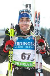 05.03.2011, Khanty-Mansiysk, Russia (RUS): Martin Fourcade (FRA), Rossignol, Rottefella, OneWay, Odlo - IBU world championships biathlon, medals, Khanty-Mansiysk (RUS). www.xpb.cc. © Manzoni/xpb.cc. Every downloaded picture is fee-liable.