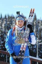 02.03.2011, Khanty-Mansiysk, Russia (RUS): Dorothea Wierer (ITA), Rossignol, Rottefella, Casco with her four gold and three silver medals from the Junior World Championships and the European Championship- IBU world championships biathlon, medals, Khanty-Mansiysk (RUS). www.xpb.cc. © Manzoni/xpb.cc. Every downloaded picture is fee-liable.