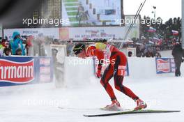 06.03.2011, Khanty-Mansiysk, Russia (RUS): Tarjei Boe (NOR), Fischer, Rottefella, Swix, ODLO falls down at the shooting range - IBU world championships biathlon, pursuit men, Khanty-Mansiysk (RUS). www.xpb.cc. © Manzoni/xpb.cc. Every downloaded picture is fee-liable.