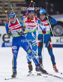 03.03.2011, Khanty-Mansiysk, Russia (RUS): Carl-Johan Bergman (SWE), Rossignol, Rottefella, Leki, adidas leads Martin Fourcade (FRA), Rossignol, Rottefella, OneWay, Odlo and Timo Antila (FIN), Peltonen, Rottefella, Alpina, One Way - IBU world championships biathlon, relay mixed, Khanty-Mansiysk (RUS). www.xpb.cc. Â© Miko/xpb.cc. Every downloaded picture is fee-liable.