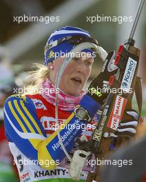 03.03.2011, Khanty-Mansiysk, Russia (RUS): Helena Ekholm (SWE), Fischer, Rottefella, Leki, adidas - IBU world championships biathlon, relay mixed, Khanty-Mansiysk (RUS). www.xpb.cc. Â© Miko/xpb.cc. Every downloaded picture is fee-liable.