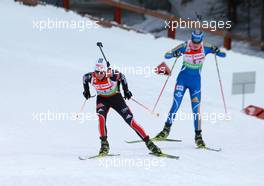 03.03.2011, Khanty-Mansiysk, Russia (RUS): Andrea Henkel (GER), Fischer, Rottefella, Exel, adidas, Toko, Helena Ekholm (SWE), Fischer, Rottefella, Leki, adidas - IBU world championships biathlon, relay mixed, Khanty-Mansiysk (RUS). www.xpb.cc. © Manzoni/xpb.cc. Every downloaded picture is fee-liable.