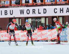 03.03.2011, Khanty-Mansiysk, Russia (RUS): Arnd Peiffer (GER), Fischer, Salomon, Swix, adidas, Magdalena Neuner (GER), Fischer, Rottefella, Exel, adidas, Ole Einar Bjoerndalen (NOR), Madshus, Rottefella, Odlo - IBU world championships biathlon, relay mixed, Khanty-Mansiysk (RUS). www.xpb.cc. © Manzoni/xpb.cc. Every downloaded picture is fee-liable.