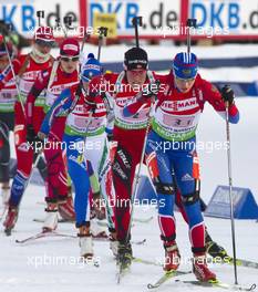 03.03.2011, Khanty-Mansiysk, Russia (RUS): Svetlana Sleptsova (RUS), Fischer, Rottefella, Alpina, Swix, adidas leads Tora Berger (NOR), Fischer, Rottefella, Odlo - IBU world championships biathlon, relay mixed, Khanty-Mansiysk (RUS). www.xpb.cc. Â© Miko/xpb.cc. Every downloaded picture is fee-liable.