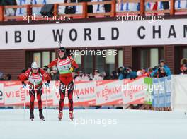 03.03.2011, Khanty-Mansiysk, Russia (RUS): Ole Einar Bjoerndalen (NOR), Madshus, Rottefella, Odlo, Ann Kristin Aafedt Flatland (NOR), Madshus, Rottefella, Alpina, Swix, ODLO - IBU world championships biathlon, relay mixed, Khanty-Mansiysk (RUS). www.xpb.cc. © Manzoni/xpb.cc. Every downloaded picture is fee-liable.