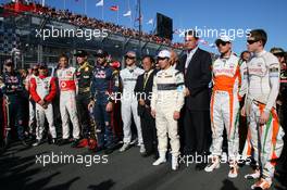 27.03.2011 Melbourne, Australia,  The F1 drivers stand for a minute silence for Japan - Formula 1 World Championship, Rd 01, Australian Grand Prix, Sunday Pre-Race Grid