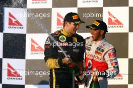 27.03.2011 Melbourne, Australia,  3rd place Vitaly Petrov (RUS), Lotus Renault GP and Lewis Hamilton (GBR), McLaren Mercedes  - Formula 1 World Championship, Rd 01, Australian Grand Prix, Sunday Podium