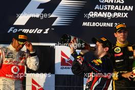 27.03.2011 Melbourne, Australia,  1st place with Sebastian Vettel (GER), Red Bull Racing with 2nd place Lewis Hamilton (GBR), McLaren Mercedes and 3rd place Vitaly Petrov (RUS), Lotus Renault GP - Formula 1 World Championship, Rd 01, Australian Grand Prix, Sunday Podium