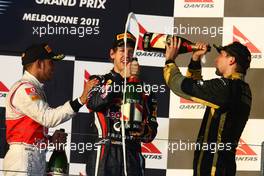 27.03.2011 Melbourne, Australia,  1st place with Sebastian Vettel (GER), Red Bull Racing with 2nd place Lewis Hamilton (GBR), McLaren Mercedes and 3rd place Vitaly Petrov (RUS), Lotus Renault GP - Formula 1 World Championship, Rd 01, Australian Grand Prix, Sunday Podium