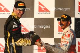 27.03.2011 Melbourne, Australia,  Vitaly Petrov (RUS), Lotus Renault GP and Lewis Hamilton (GBR), McLaren Mercedes - Formula 1 World Championship, Rd 01, Australian Grand Prix, Sunday Podium