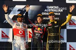 27.03.2011 Melbourne, Australia,  1st place with Sebastian Vettel (GER), Red Bull Racing with 2nd place Lewis Hamilton (GBR), McLaren Mercedes and 3rd place Vitaly Petrov (RUS), Lotus Renault GP - Formula 1 World Championship, Rd 01, Australian Grand Prix, Sunday Podium