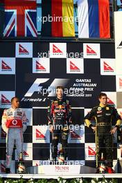 27.03.2011 Melbourne, Australia,  1st place with Sebastian Vettel (GER), Red Bull Racing with 2nd place Lewis Hamilton (GBR), McLaren Mercedes and 3rd place Vitaly Petrov (RUS), Lotus Renault GP - Formula 1 World Championship, Rd 01, Australian Grand Prix, Sunday Podium