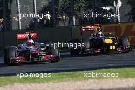 27.03.2011 Melbourne, Australia,  Jenson Button (GBR), McLaren Mercedes and Sebastian Vettel (GER), Red Bull Racing  - Formula 1 World Championship, Rd 01, Australian Grand Prix, Sunday Race