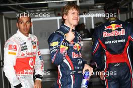 26.03.2011 Melbourne, Australia,  pole position for Sebastian Vettel (GER), Red Bull Racing, 2nd for Lewis Hamilton (GBR), McLaren Mercedes and 3rd for Mark Webber (AUS), Red Bull Racing - Formula 1 World Championship, Rd 01, Australian Grand Prix, Saturday Qualifying