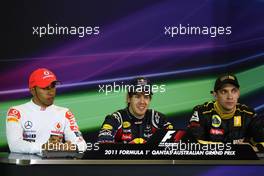 27.03.2011 Melbourne, Australia,  Lewis Hamilton (GBR), McLaren Mercedes with Sebastian Vettel (GER), Red Bull Racing and Vitaly Petrov (RUS), Lotus Renault GP - Formula 1 World Championship, Rd 01, Australian Grand Prix, Sunday Press Conference